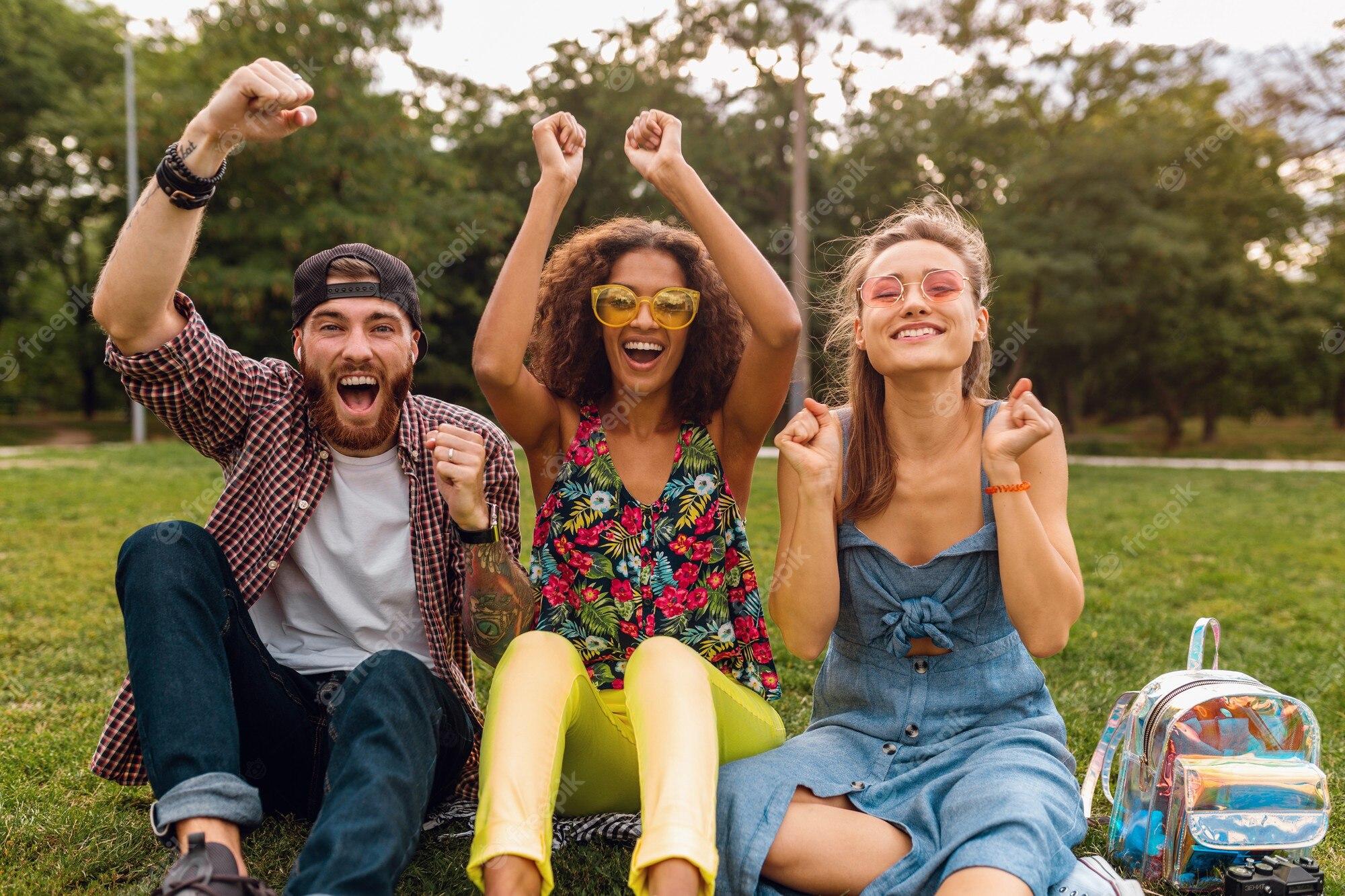 happy-young-company-smiling-friends-sitting-park-grass-man-women-having-fun-together_285396-8810.jpg